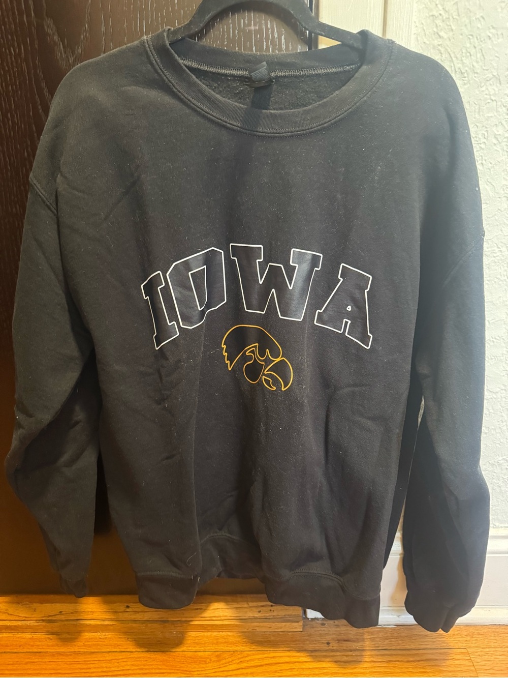 Gildan Black Crewneck Sweatshirt with Iowa Graphic and Gold Accent